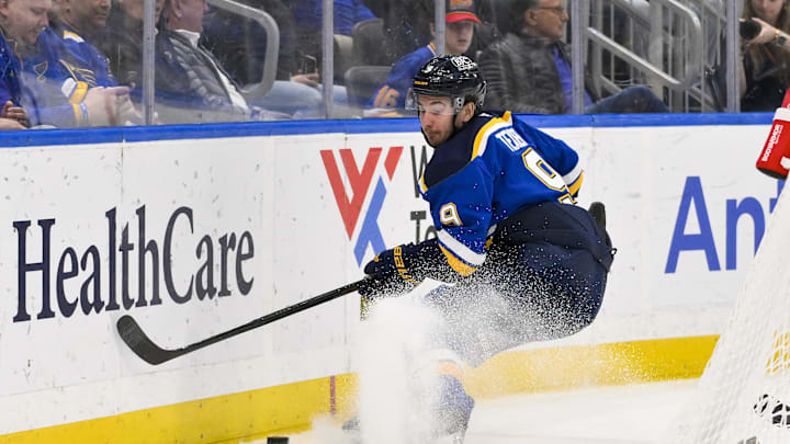 Mar 23, 2025; St. Louis, Missouri, USA;  St. Louis Blues center Alexandre Texier (9) controls the puck against the Nashville Predators during the second period at Enterprise Center. Mandatory Credit: Jeff Curry-Imagn Images