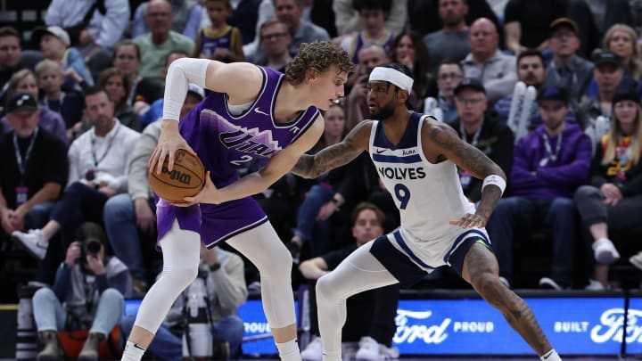 Mar 18, 2024; Salt Lake City, Utah, USA; Utah Jazz forward Lauri Markkanen (23) looks to move the ball against Minnesota Timberwolves guard Nickeil Alexander-Walker (9) during the fourth quarter at Delta Center. Mandatory Credit: Rob Gray-USA TODAY Sports
