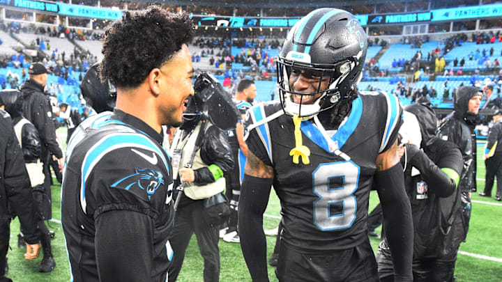 Dec 17, 2023; Charlotte, North Carolina, USA; Carolina Panthers quarterback Bryce Young (9) with cornerback Jaycee Horn (8) after the game at Bank of America Stadium. 