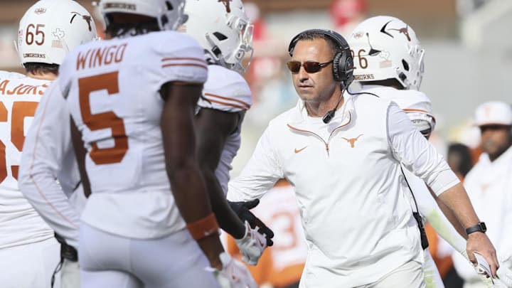 Nov 16, 2024; Fayetteville, Arkansas, USA; Texas Longhorns head coach Steve Sarkisian celebrates after a score in the fourth quarter against the Arkansas Razorbacks at Donald W. Reynolds Razorback Stadium. Texas won 20-10. Mandatory Credit: Nelson Chenault-Imagn Images