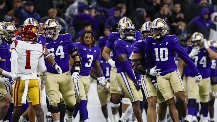 Nov 2, 2024; Seattle, Washington, USA; Washington Huskies edge Lance Holtzclaw (10) celebrates following a fourth down turnover by the USC Trojans during the fourth quarter at Alaska Airlines Field at Husky Stadium. Mandatory Credit: Joe Nicholson-Imagn Images