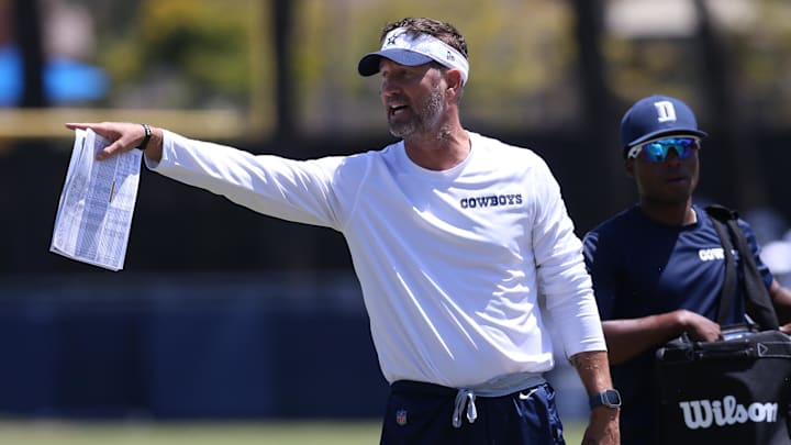 Jul 30, 2024; Oxnard, CA, USA; Dallas Cowboys offensive coordinator Brian Schottenheimer during training camp at the River Ridge Playing Fields in Oxnard, California. Mandatory Credit: Jason Parkhurst-Imagn Images