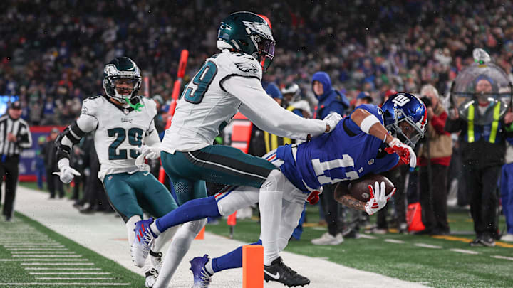Jan 7, 2024; East Rutherford, New Jersey, USA; New York Giants wide receiver Wan'Dale Robinson (17) is tackled before the pylon by Philadelphia Eagles cornerback Eli Ricks (39) pursues during the first half at MetLife Stadium. Mandatory Credit: Vincent Carchietta-Imagn Images