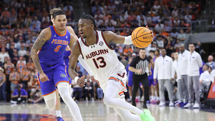 Feb 8, 2025; Auburn, Alabama, USA;  Auburn Tigers guard Miles Kelly (13) runs a play against the Florida Gators during the second half at Neville Arena. Mandatory Credit: John Reed-Imagn Images