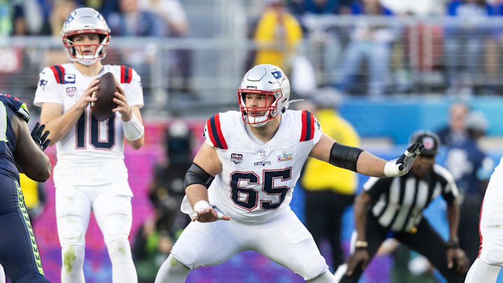 Feb 8, 2026; Santa Clara, CA, USA; New England Patriots center Garrett Bradbury (65) blocks for quarterback Drake Maye (10) against the Seattle Seahawks during Super Bowl LX at Levi's Stadium. Mandatory Credit: Mark J. Rebilas-Imagn Images