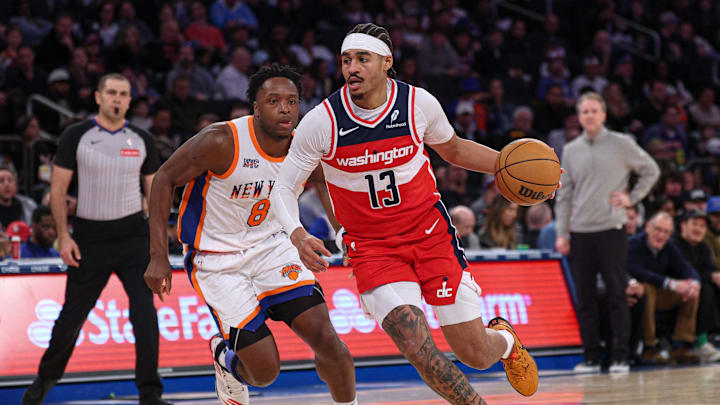 Mar 22, 2025; New York, New York, USA; Washington Wizards guard Jordan Poole (13) dribbles in front of New York Knicks forward OG Anunoby (8) during the second half at Madison Square Garden. Mandatory Credit: Vincent Carchietta-Imagn Images