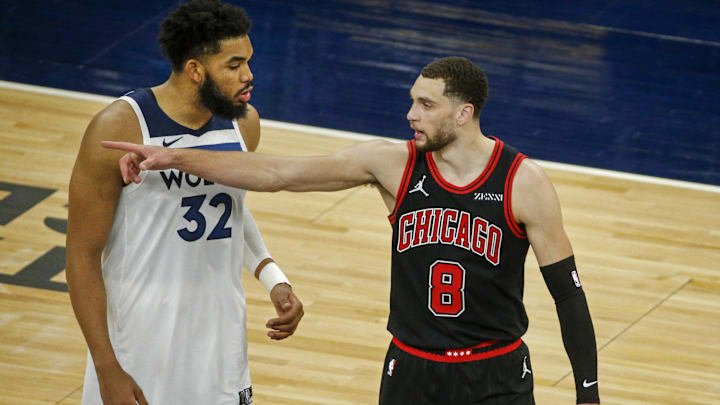 Minnesota Timberwolves center Karl-Anthony Towns (32) with former teammate Chicago Bulls guard Zach LaVine (8) after the game at Target Center. 