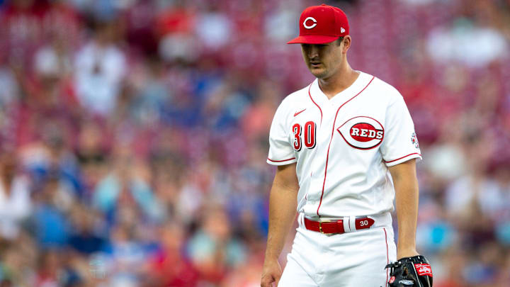 Cincinnati Reds starting pitcher Tyler Mahle (30) walks back to the dugout.