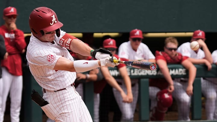 Mar 29, 2025; Tuscaloosa, AL, USA; Alabama infielder Garrett Staton (27) connects for a hit against Oklahoma at Sewell-Thomas Stadium. Oklahoma evened the series with a 6-5 win.