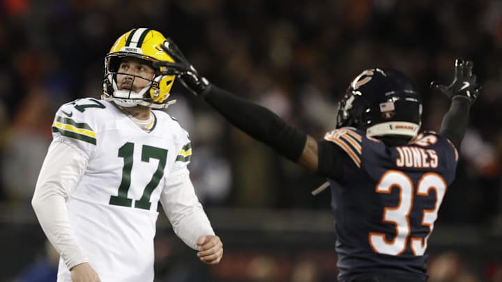 Jan 10, 2026; Chicago, IL, USA; Green Bay Packers place kicker Brandon McManus (17) reacts to missing a field goal late in the fourth quarter as Chicago Bears cornerback Jaylon Jones (33) celebrates in an NFC Wild Card Round game at Soldier Field. Mandatory Credit: Dan Powers/USA TODAY Network via Imagn Images
