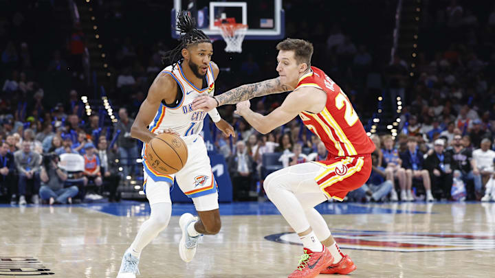 Oct 17, 2024; Oklahoma City, Oklahoma, USA; Oklahoma City Thunder guard Isaiah Joe (11) drives down the court against Atlanta Hawks guard Vit Krejci (27) during the second half at Paycom Center. Mandatory Credit: Alonzo Adams-Imagn Images