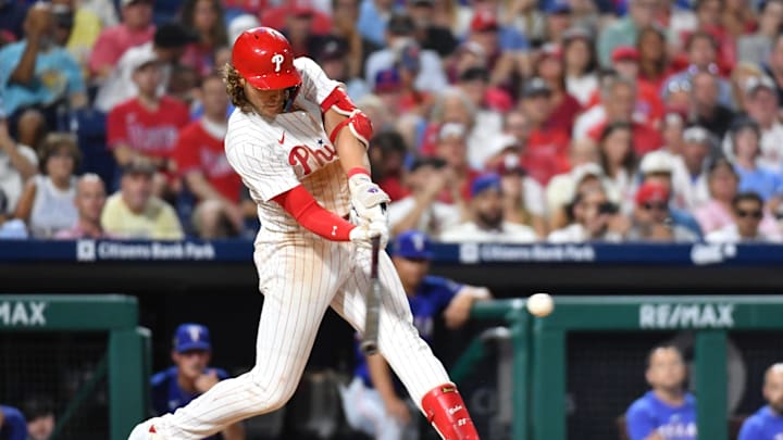 May 22, 2024; Philadelphia, Pennsylvania, USA; Philadelphia Phillies third base Alec Bohm (28) hits a two RBI double during the sixth inning against the Texas Rangers at Citizens Bank Park. 