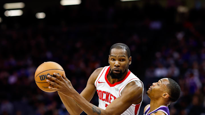 Dec 21, 2025; Sacramento, California, USA; Houston Rockets forward Kevin Durant (7) controls the ball against Sacramento Kings guard Russell Westbrook (18) during the fourth quarter at Golden 1 Center. Mandatory Credit: Sergio Estrada-Imagn Images