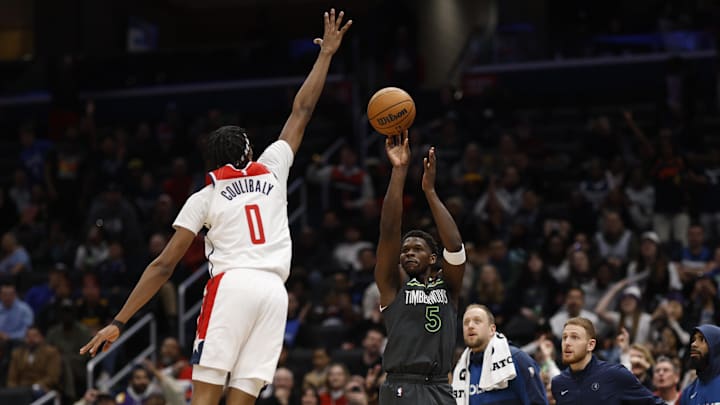 Jan 13, 2025; Washington, District of Columbia, USA; Minnesota Timberwolves guard Anthony Edwards (5) shoots the ball over Washington Wizards guard Bilal Coulibaly (0) in the fourth quarter at Capital One Arena. Mandatory Credit: Geoff Burke-Imagn Images