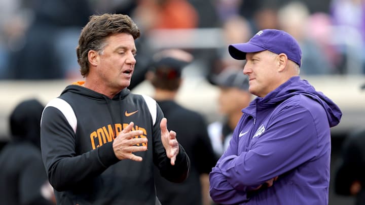 Oct 6, 2023; Stillwater, Oklahoma, USA; Oklahoma State head coach Mike Gundy talks with Kansas State head coach Chris Klieman before the college football game between the Oklahoma State University Cowboys and the Kansas State Wildcats at Boone Pickens Stadium. Mandatory Credit: Sarah Phipps-Imagn Images Oct 6, 2023; Stillwater, Oklahoma, USA; Oklahoma State head coach Mike Gundy talks with Kansas State head coach Chris Klieman before the college football game between the Oklahoma State University Cowboys and the Kansas State Wildcats at Boone Pickens Stadium. Mandatory Credit: Sarah Phipps-Imagn Images