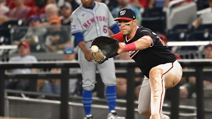 Jul 2, 2024; Washington, District of Columbia, USA; Washington Nationals first baseman Joey Meneses (45) catches the ball at first base for an out against the New York Mets during the ninth inning at Nationals Park. Mandatory Credit: Rafael Suanes-Imagn Images