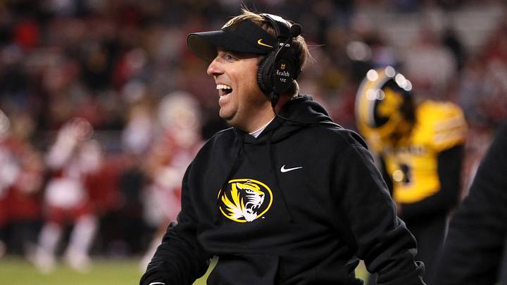 Nov 24, 2023; Fayetteville, Arkansas, USA; Missouri Tigers head coach Eli Drinkwitz celebrates after a defensive touchdown in the third quarter against the Arkansas Razorbacks at Donald W. Reynolds Razorback Stadium. Missouri won 48-14. Mandatory Credit: Nelson Chenault-USA TODAY Sports Nov 24, 2023; Fayetteville, Arkansas, USA; Missouri Tigers head coach Eli Drinkwitz celebrates after a defensive touchdown in the third quarter against the Arkansas Razorbacks at Donald W. Reynolds Razorback Stadium. Missouri won 48-14. Mandatory Credit: Nelson Chenault-USA TODAY Sports