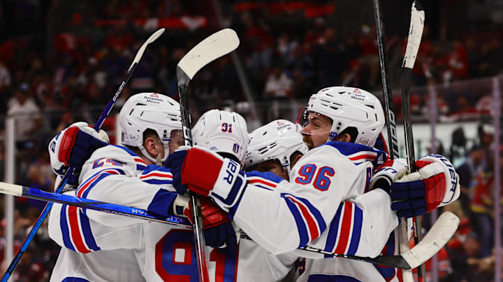 May 26, 2024; Sunrise, Florida, USA; New York Rangers center Alex Wennberg (91) celebrates with center Jack Roslovic (96) and right wing Kaapo Kakko (24) after scoring the game-winning goal in overtime against the Florida Panthers in game three of the Eastern Conference Final of the 2024 Stanley Cup Playoffs at Amerant Bank Arena. Mandatory Credit: Sam Navarro-USA TODAY Sports