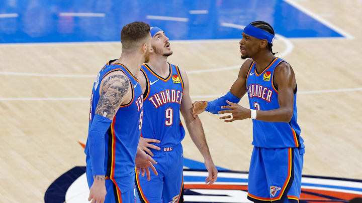 Jun 8, 2025; Oklahoma City, Oklahoma, USA; Oklahoma City Thunder center Isaiah Hartenstein (55) and guard Alex Caruso (9) and guard Shai Gilgeous-Alexander (2) talk during the third quarter against the Indiana Pacers in game two of the 2025 NBA Finals at Paycom Center. Mandatory Credit: Alonzo Adams-Imagn Images Jun 8, 2025; Oklahoma City, Oklahoma, USA; Oklahoma City Thunder center Isaiah Hartenstein (55) and guard Alex Caruso (9) and guard Shai Gilgeous-Alexander (2) talk during the third quarter against the Indiana Pacers in game two of the 2025 NBA Finals at Paycom Center. Mandatory Credit: Alonzo Adams-Imagn Images