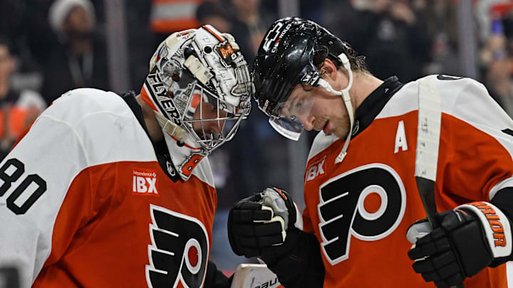 Dec 22, 2025; Philadelphia, Pennsylvania, USA; Philadelphia Flyers goaltender Dan Vladar (80) and Philadelphia Flyers defenseman Travis Sanheim (6) celebrate win against the Vancouver Canucks at Xfinity Mobile Arena. Mandatory Credit: Eric Hartline-Imagn Images