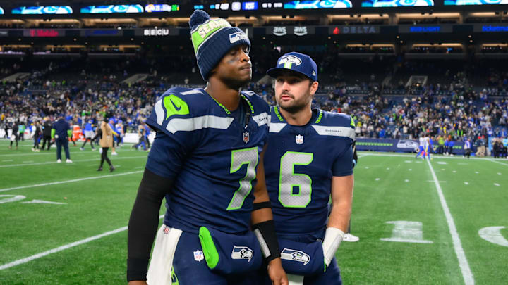 Nov 3, 2024; Seattle, Washington, USA; Seattle Seahawks quarterback Geno Smith (7) and Seattle Seahawks quarterback Sam Howell (6) walk off the field after the game against the Los Angeles Rams half at Lumen Field. Mandatory Credit: Steven Bisig-Imagn Images