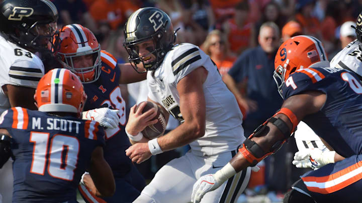 Oct 12, 2024; Champaign, Illinois, USA; Purdue Boilermakers quarterback Ryan Browne (15) runs with the ball in the first half against the Illinois Fighting Illini at Memorial Stadium. Mandatory Credit: Ron Johnson-Imagn Images Oct 12, 2024; Champaign, Illinois, USA; Purdue Boilermakers quarterback Ryan Browne (15) runs with the ball in the first half against the Illinois Fighting Illini at Memorial Stadium. Mandatory Credit: Ron Johnson-Imagn Images