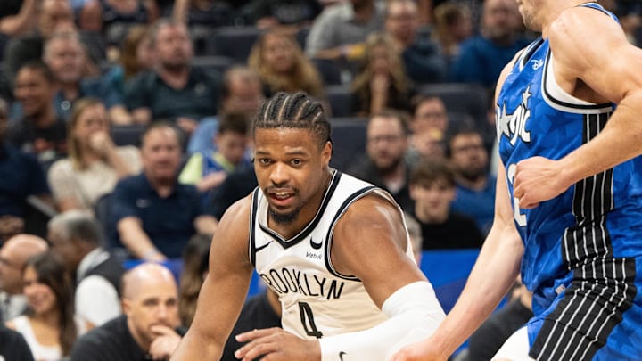 Mar 13, 2024; Orlando, Florida, USA; Brooklyn Nets guard Dennis Smith Jr. (4) dribbles the ball against Orlando Magic forward Franz Wagner (22) in the second quarter at Kia Center. Mandatory Credit: Jeremy Reper-Imagn Images Mar 13, 2024; Orlando, Florida, USA; Brooklyn Nets guard Dennis Smith Jr. (4) dribbles the ball against Orlando Magic forward Franz Wagner (22) in the second quarter at Kia Center. Mandatory Credit: Jeremy Reper-Imagn Images