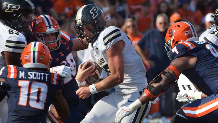 Purdue Boilermakers quarterback Ryan Browne (15) runs with the ball.