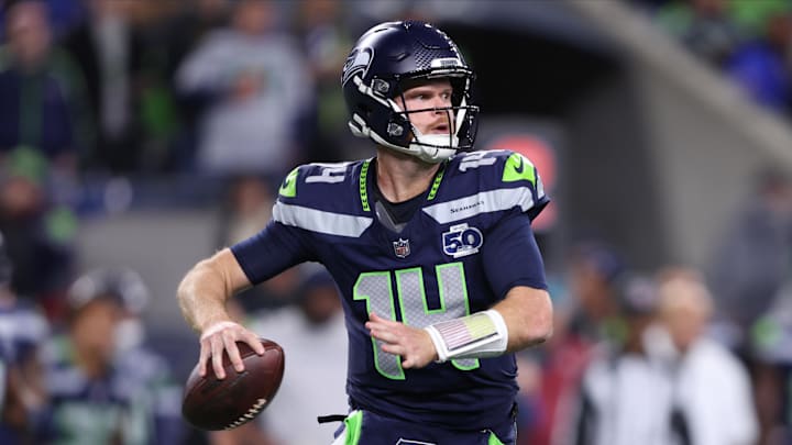 Oct 20, 2025; Seattle, Washington, USA; Seattle Seahawks quarterback Sam Darnold (14) looks to throw a pass during the second quarter against the Houston Texans at Lumen Field.