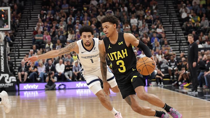 Oct 23, 2024; Salt Lake City, Utah, USA; Utah Jazz guard Keyonte George (3) dribbles away from Memphis Grizzlies guard Scotty Pippen Jr. (1) during the first quarter at Delta Center. Mandatory Credit: Chris Nicoll-Imagn Images
