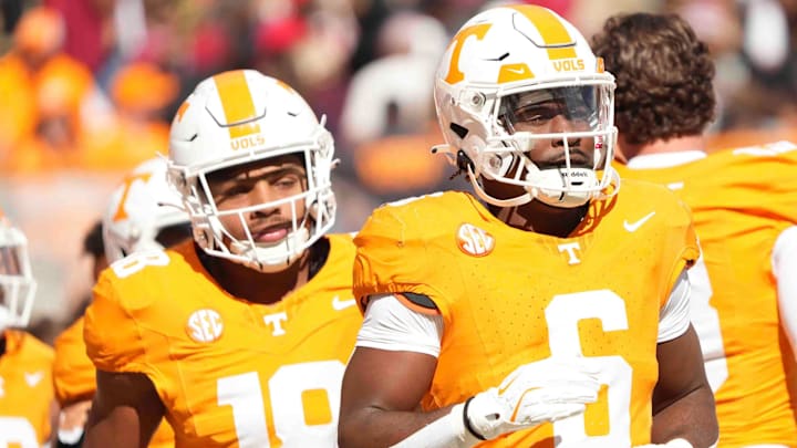 Players warm up before a game between Tennessee and Alabama at Neyland Stadium in Knoxville, Tenn., Saturday, Oct. 19, 2024.
