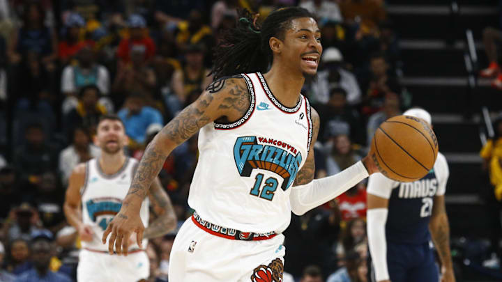 Apr 18, 2025; Memphis, Tennessee, USA; Memphis Grizzlies guard Ja Morant (12) drives to the basket during the fourth quarter against the Dallas Mavericks at FedExForum. Mandatory Credit: Petre Thomas-Imagn Images