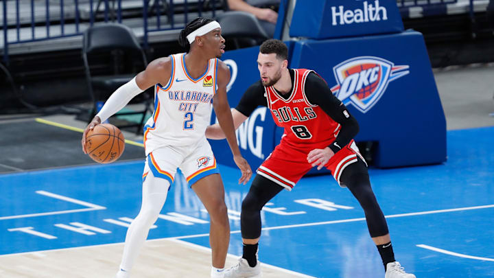 Oklahoma City Thunder guard Shai Gilgeous-Alexander (2) drives to the basket as Chicago Bulls guard Zach LaVine (8) defends during the first half at Chesapeake Energy Arena. Mandatory Credit: Alonzo Adams-Imagn Images