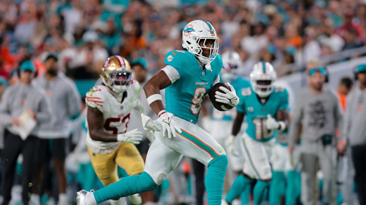 Dec 22, 2024; Miami Gardens, Florida, USA; Miami Dolphins tight end Jonnu Smith (9) runs with the football against the San Francisco 49ers during the third quarter at Hard Rock Stadium. 