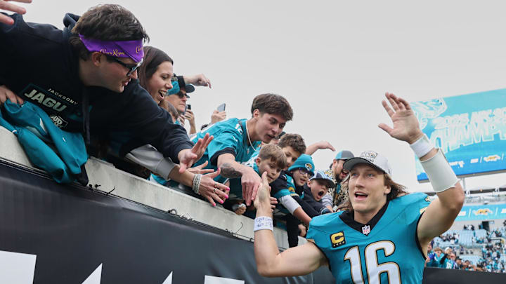 Jan 4, 2026; Jacksonville, Florida, USA; Jacksonville Jaguars quarterback Trevor Lawrence (16) celebrates with fans after the game against the Tennessee Titans at EverBank Stadium. Mandatory Credit: Morgan Tencza-Imagn Images