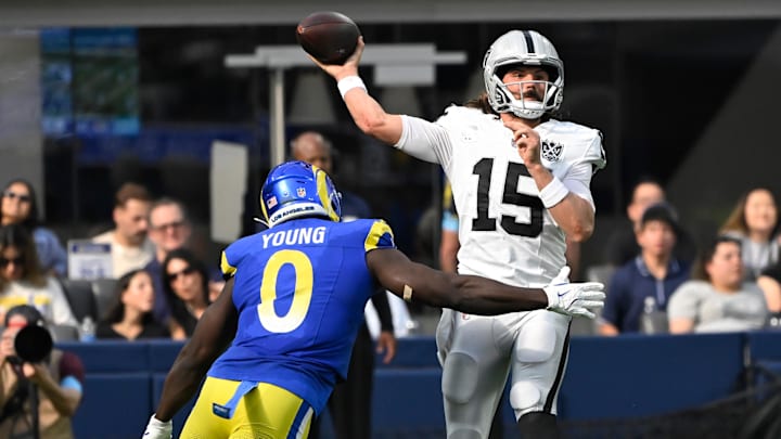 Oct 20, 2024; Inglewood, California, USA; Las Vegas Raiders quarterback Gardner Minshew (15) gets off a pass under pressure by Los Angeles Rams linebacker Byron Young (0) during the third quarter at SoFi Stadium. Mandatory Credit: Robert Hanashiro-Imagn Images Oct 20, 2024; Inglewood, California, USA; Las Vegas Raiders quarterback Gardner Minshew (15) gets off a pass under pressure by Los Angeles Rams linebacker Byron Young (0) during the third quarter at SoFi Stadium. Mandatory Credit: Robert Hanashiro-Imagn Images