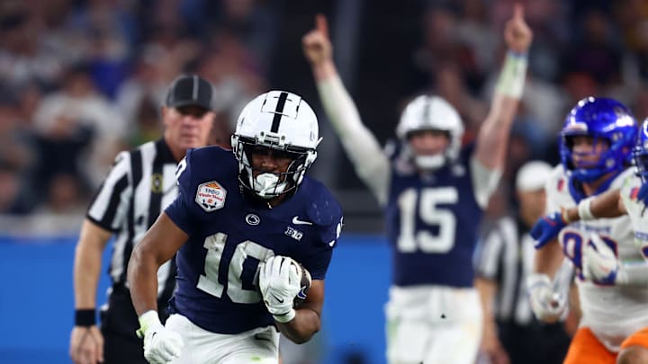 Dec 31, 2024; Glendale, AZ, USA; Penn State Nittany Lions running back Nicholas Singleton (10) rushes for a touchdown against the Boise State Broncos during the second half in the Fiesta Bowl at State Farm Stadium. Mandatory Credit: Mark J. Rebilas-Imagn Images