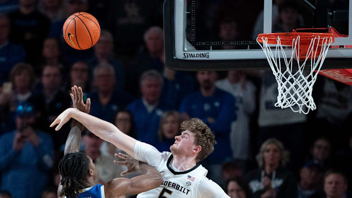 Vanderbilt Commodores guard Tyler Nickel (5) pressures the shot of Kentucky Wildcats guard Otega Oweh (00) during their game at Memorial Gym in Nashville, Tenn., Saturday, Jan. 25, 2025.