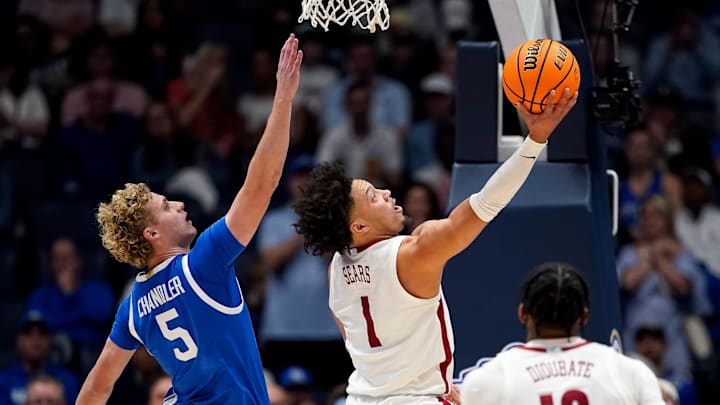 Alabama guard Mark Sears (1) shoots past Kentucky guard Collin Chandler (5) during the first half of a Southeastern Conference tournament quarterfinal game at Bridgestone Arena in Nashville, Tenn., Friday, March 14, 2025.