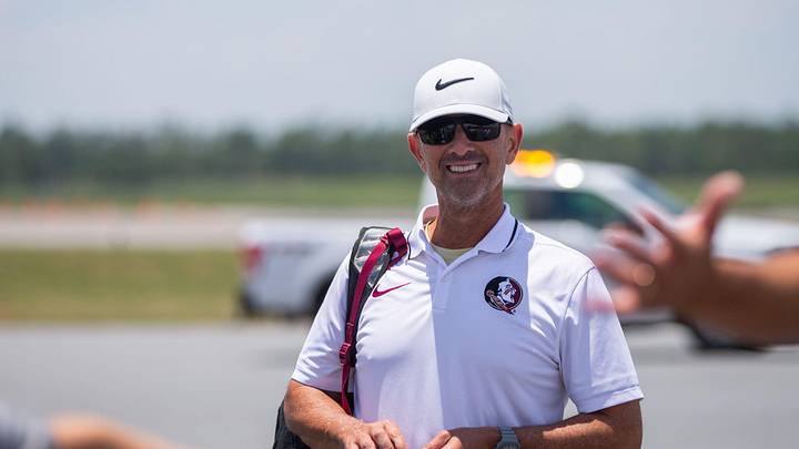 Florida State baseball coach Link Jarrett boards a plane with his team as they leave to play in the College World Series in Omaha, Nebraska, Wednesday, June 12, 2024.