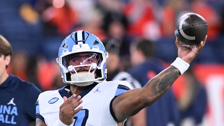 Oct 31, 2025; Syracuse, New York, USA; North Carolina Tar Heels quarterback Gio Lopez (7) warms up before a game against the Syracuse Orange at the JMA Wireless Dome. 