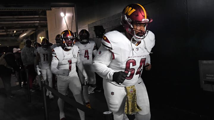 Nov 14, 2024; Philadelphia, Pennsylvania, USA; Washington Commanders defensive tackle Sheldon Day (64) against the Philadelphia Eagles at Lincoln Financial Field. Mandatory Credit: Eric Hartline-Imagn Images