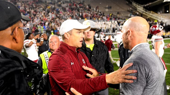 Nov 9, 2024; Nashville, Tennessee, USA;  Vanderbilt Commodores head coach Clark Lea (right) congratulates South Carolina Gamecocks head coach Shane Beamer after a game at FirstBank Stadium. Mandatory Credit: Steve Roberts-Imagn Images