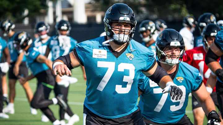 Jacksonville Jaguars center Robert Hainsey (73) warms up with Jacksonville Jaguars center Luke Fortner (79) during the seventh organized team activity at the Miller Electric Center in Jacksonville, Fla. Monday, June 2, 2025. [Doug Engle/Florida Times-Union]