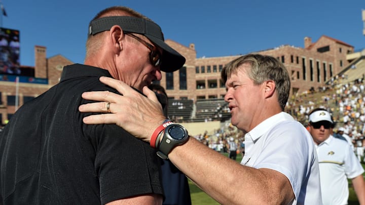 Oct 1, 2016; Boulder, CO, USA; Colorado Buffaloes head coach Mike MacIntyre greets Oregon State Beavers head coach Gary Andersen following the game Folsom Field. The Buffaloes defeated Beavers 47-6. Mandatory Credit: Ron Chenoy-Imagn Images
