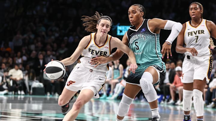 Jun 2, 2024; Brooklyn, New York, USA; Indiana Fever guard Caitlin Clark (22) looks to drive past New York Liberty forward Kayla Thornton (5) in the second quarter at Barclays Center. Mandatory Credit: Wendell Cruz-Imagn Images Jun 2, 2024; Brooklyn, New York, USA; Indiana Fever guard Caitlin Clark (22) looks to drive past New York Liberty forward Kayla Thornton (5) in the second quarter at Barclays Center. Mandatory Credit: Wendell Cruz-Imagn Images