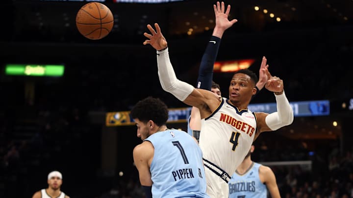 Nov 19, 2024; Memphis, Tennessee, USA; Denver Nuggets guard Russell Westbrook (4) passes the ball during the first half against the Memphis Grizzlies at FedExForum. Mandatory Credit: Petre Thomas-Imagn Images