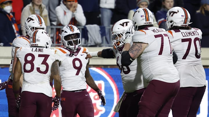 Nov 25, 2023; Charlottesville, Virginia, USA; Virginia Tech Hokies wide receiver Da'Quan Felton (9) celebrates with teammates after scoring a touchdown against the Virginia Cavaliers during the third quarter at Scott Stadium. Mandatory Credit: Geoff Burke-Imagn Images