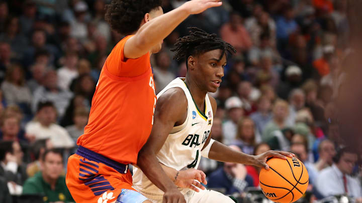 Mar 24, 2024; Memphis, TN, USA; Baylor Bears guard Ja'Kobe Walter (4) controls the ball against Clemson Tigers forward Jack Clark (5) in the second half in the second round of the 2024 NCAA Tournament at FedExForum. Mandatory Credit: Petre Thomas-Imagn Images