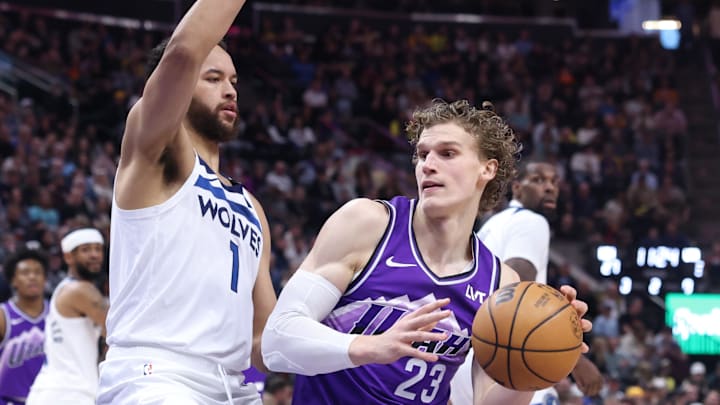 Mar 18, 2024; Salt Lake City, Utah, USA; Utah Jazz forward Lauri Markkanen (23) dribbles toward the basket against Minnesota Timberwolves forward Kyle Anderson (1) during the second quarter at Delta Center. Mandatory Credit: Rob Gray-Imagn Images